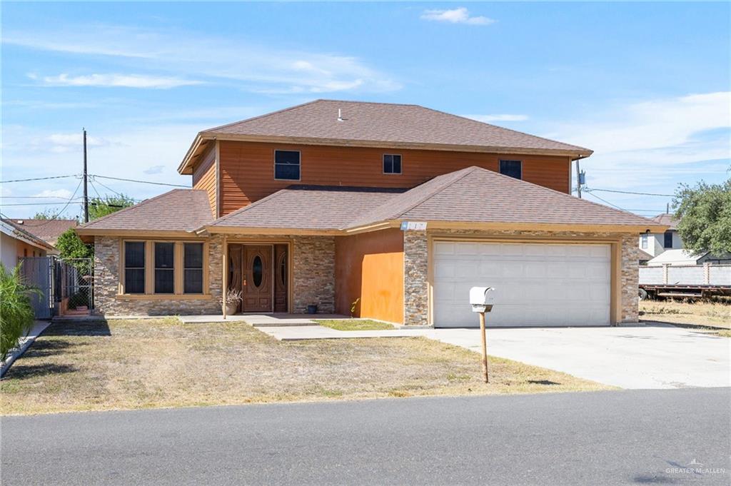 117 Hernandez Road Rio Grande City, TX 78582 - Photo 21 of 23 a front view of a house with a yard