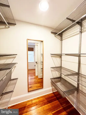a view of staircase with a rug and a window