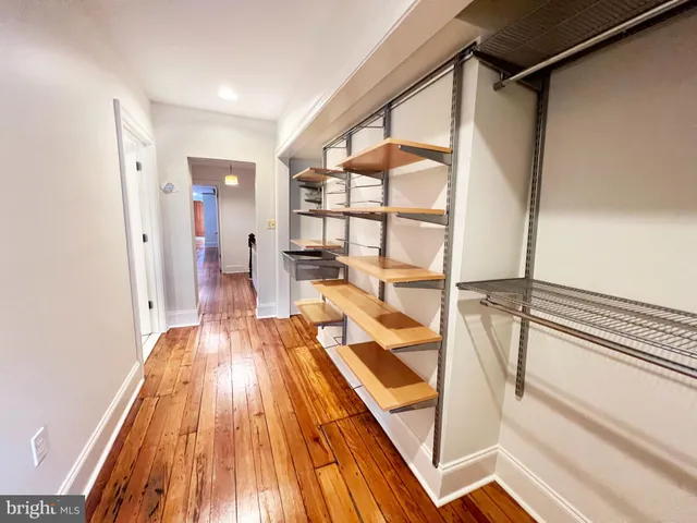 a view of a living room with a balcony wooden floor