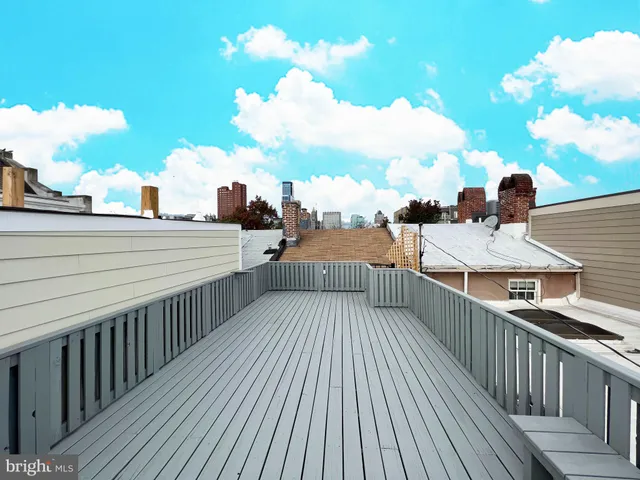 a view of a balcony with wooden floor