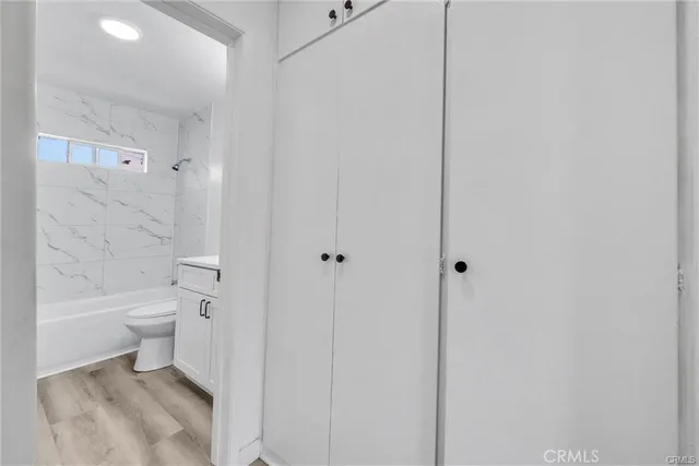 a bathroom with a toilet a sink and shower