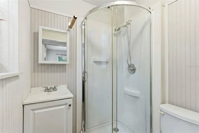 a swimming pool with outdoor seating and yard