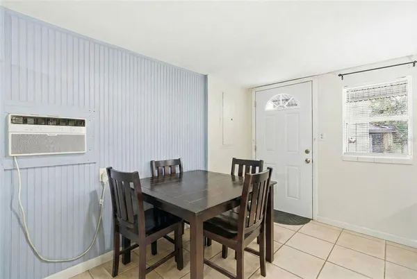 a view of a dining room with furniture and window