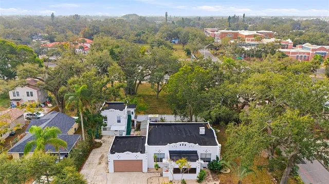 an aerial view of residential houses with outdoor space