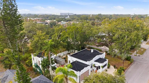 an aerial view of residential houses with outdoor space