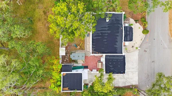 a view of a city with lush green forest