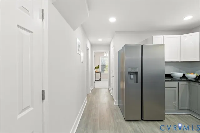 a kitchen with stainless steel appliances a refrigerator and a stove