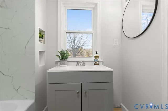 a view of hallway with wooden floor