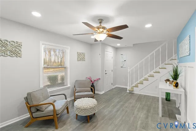 a living room with furniture and a window