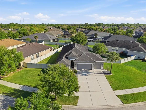 an aerial view of a house with a garden