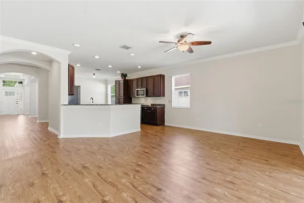 a view of a kitchen with a sink and a refrigerator