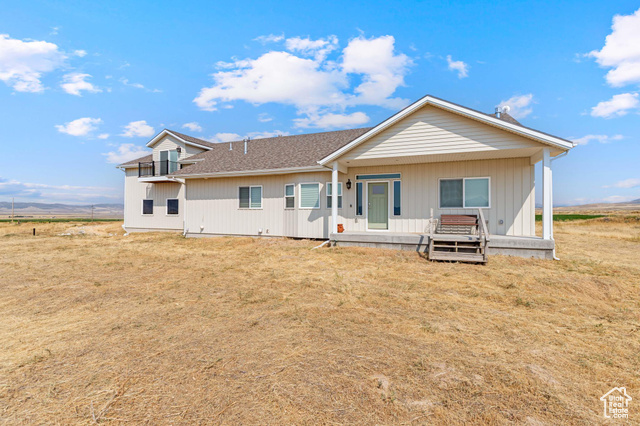 19502 South Olson Road Downey, ID 83234 - Photo 38 of 64 View of front facade with a porch and a front lawn