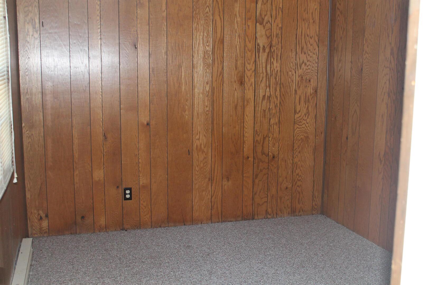 511 South Ash Street, Unit 3 Carbondale, IL 62901 - Photo 15 of 17 a view of an empty room with a wooden door