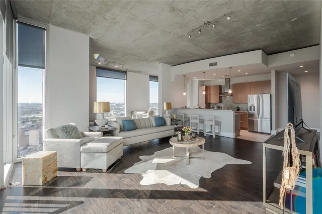 a living room with lots of furniture and a table