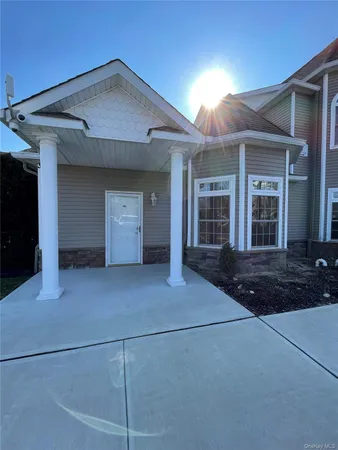 a view of a house with backyard and garage