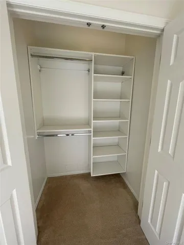 a bathroom with a toilet a sink and a mirror