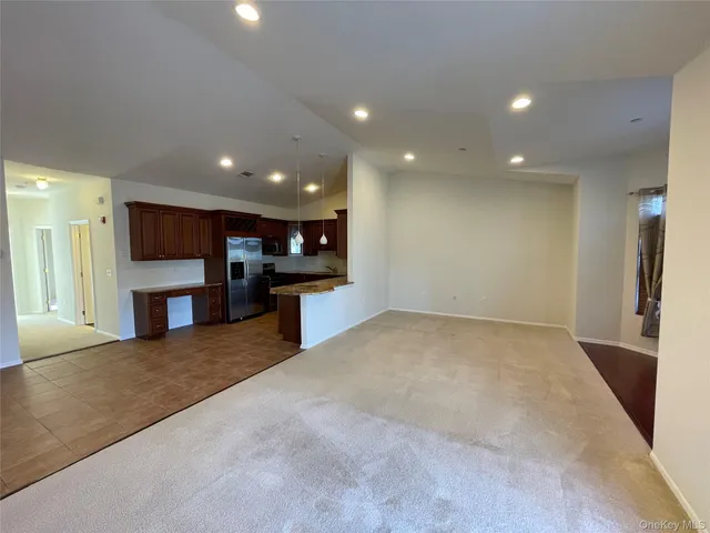 a bathroom with a tub a sink and mirror