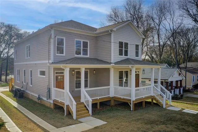 a front view of a house with a yard outdoor seating and barbeque oven