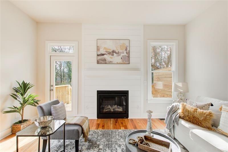 1240 Oakland Terrace Southwest, Unit B Atlanta, GA 30310 - Photo 17 of 43 a living room with furniture and a fireplace