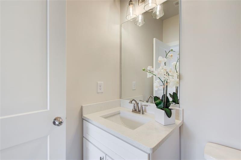 1240 Oakland Terrace Southwest, Unit B Atlanta, GA 30310 - Photo 26 of 43 a bathroom with a sink vanity and a mirror