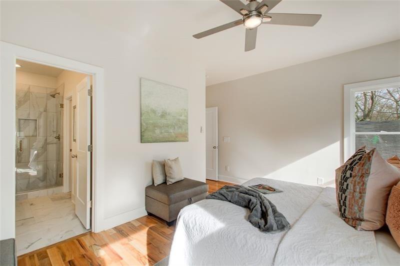 1240 Oakland Terrace Southwest, Unit B Atlanta, GA 30310 - Photo 31 of 43 a bedroom with a bed and a window