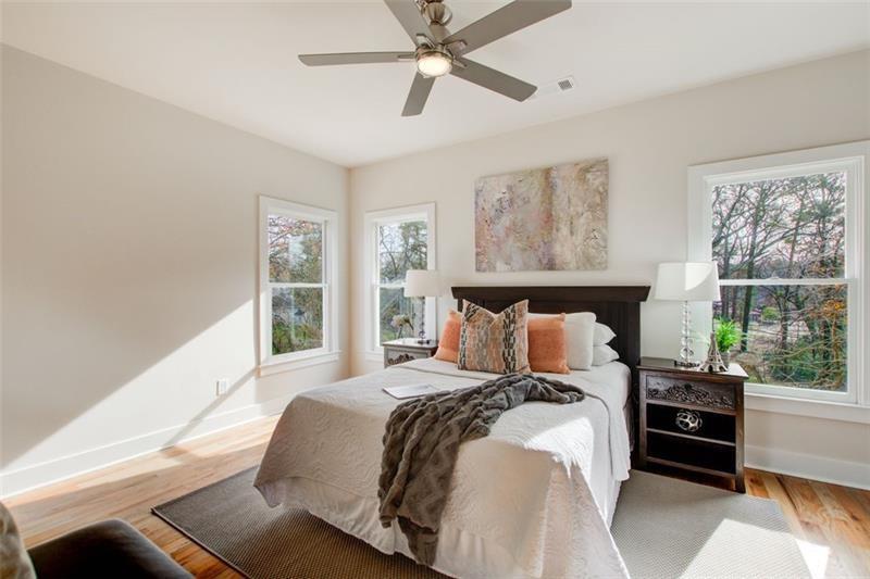 1240 Oakland Terrace Southwest, Unit B Atlanta, GA 30310 - Photo 34 of 43 a bedroom with a large bed and a window