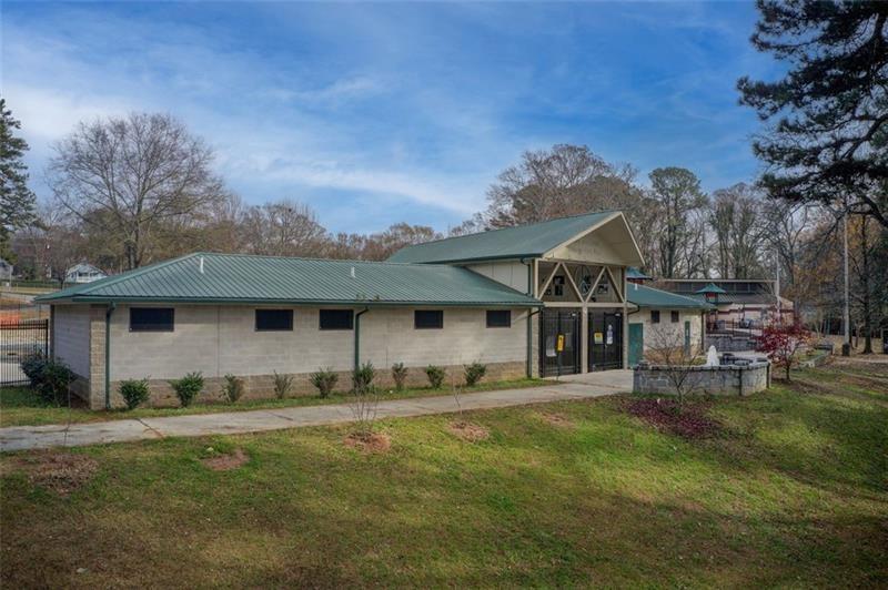 1240 Oakland Terrace Southwest, Unit B Atlanta, GA 30310 - Photo 42 of 43 a front view of a house with a garden and trees