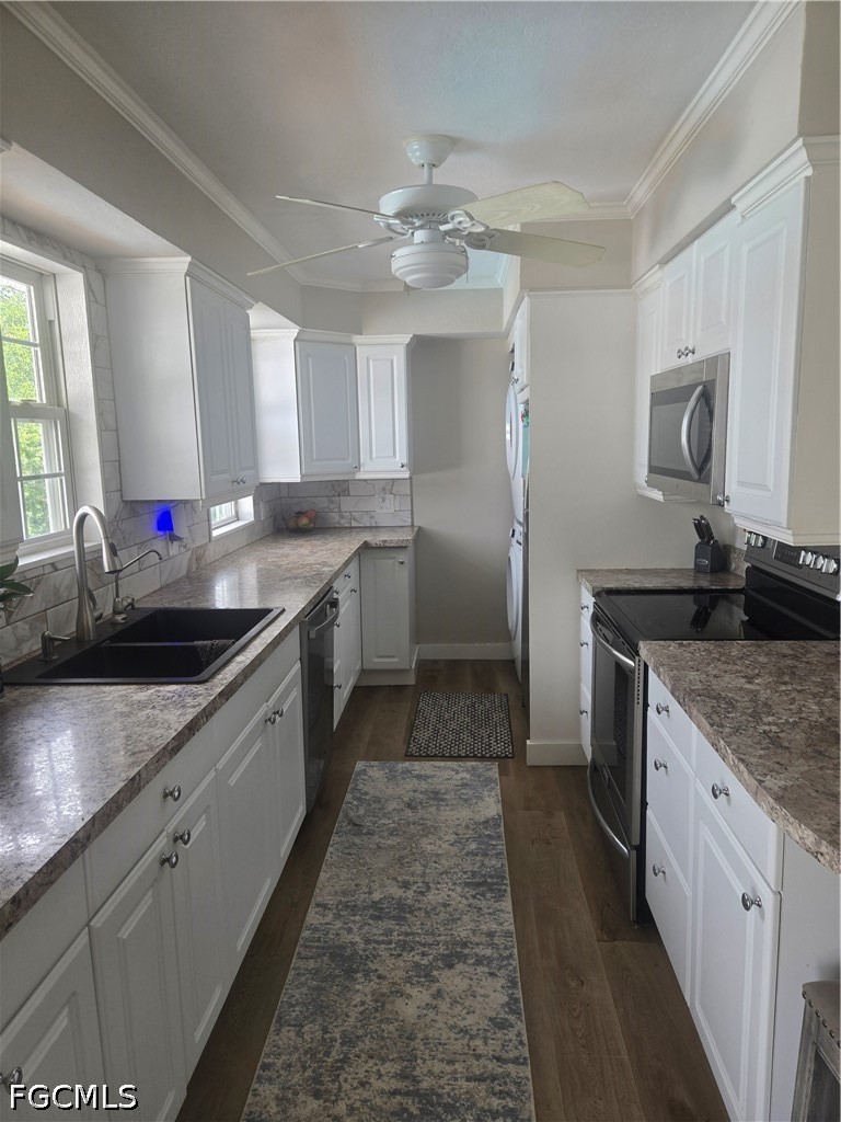 8093 Anhinga Road Fort Myers, FL 33967 - Photo 13 of 49 a kitchen with stainless steel appliances granite countertop a sink stove and refrigerator