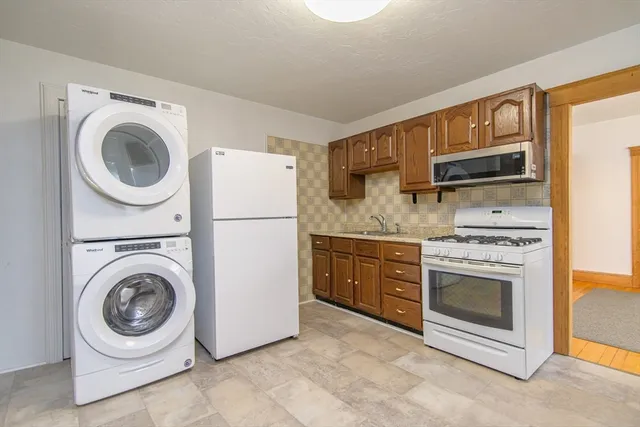 a kitchen with a washer and dryer