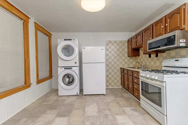 a utility room with washer and dryer
