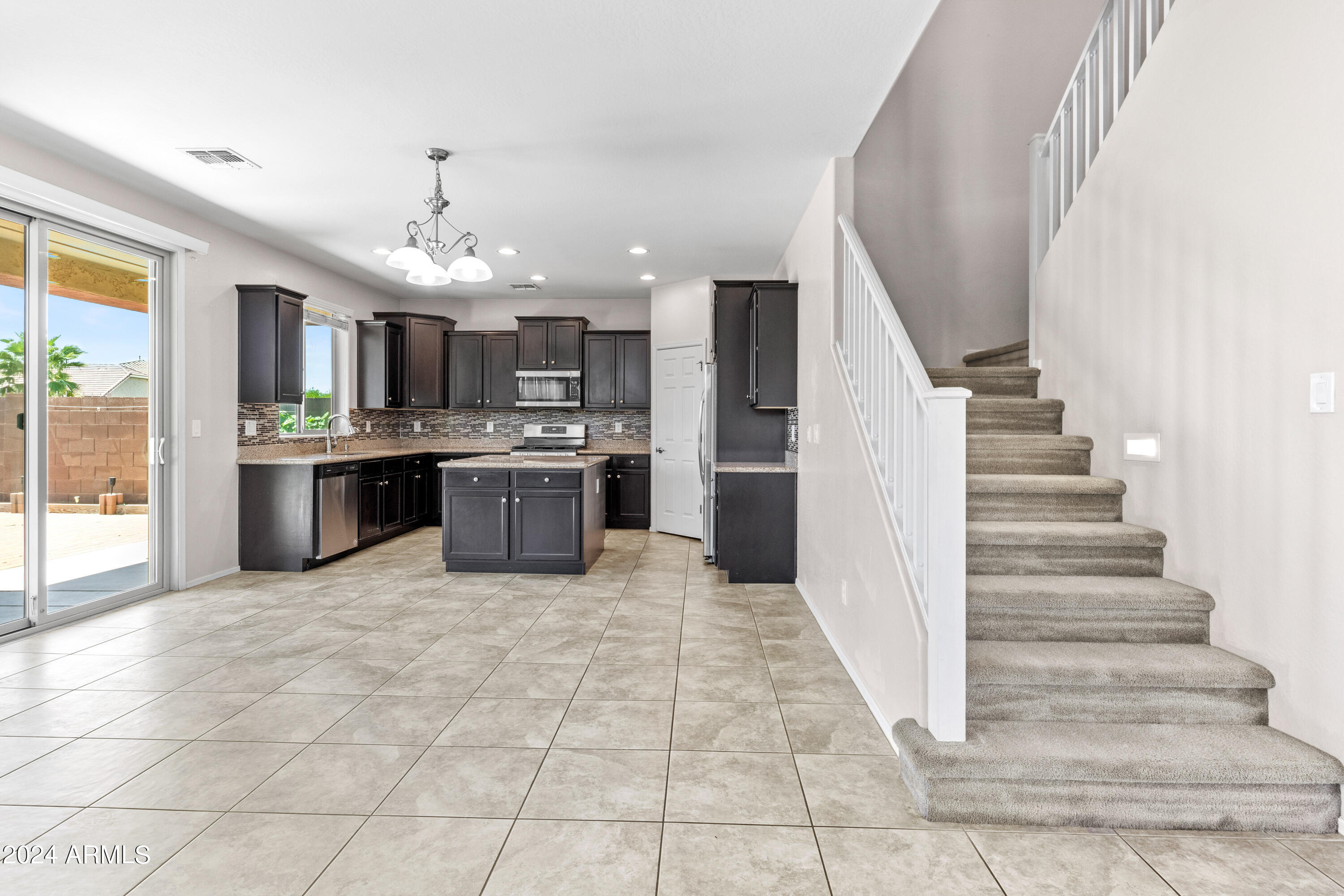 5515 West Hackamore Drive Phoenix, AZ 85083 - Photo 11 of 35 a large kitchen with cabinets and stainless steel appliances