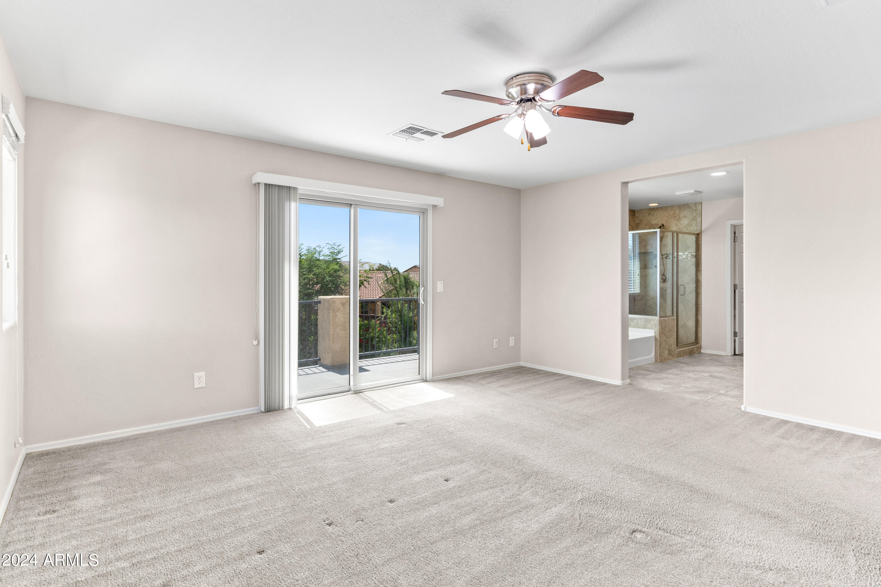 5515 West Hackamore Drive Phoenix, AZ 85083 - Photo 15 of 35 an empty room with fan and windows