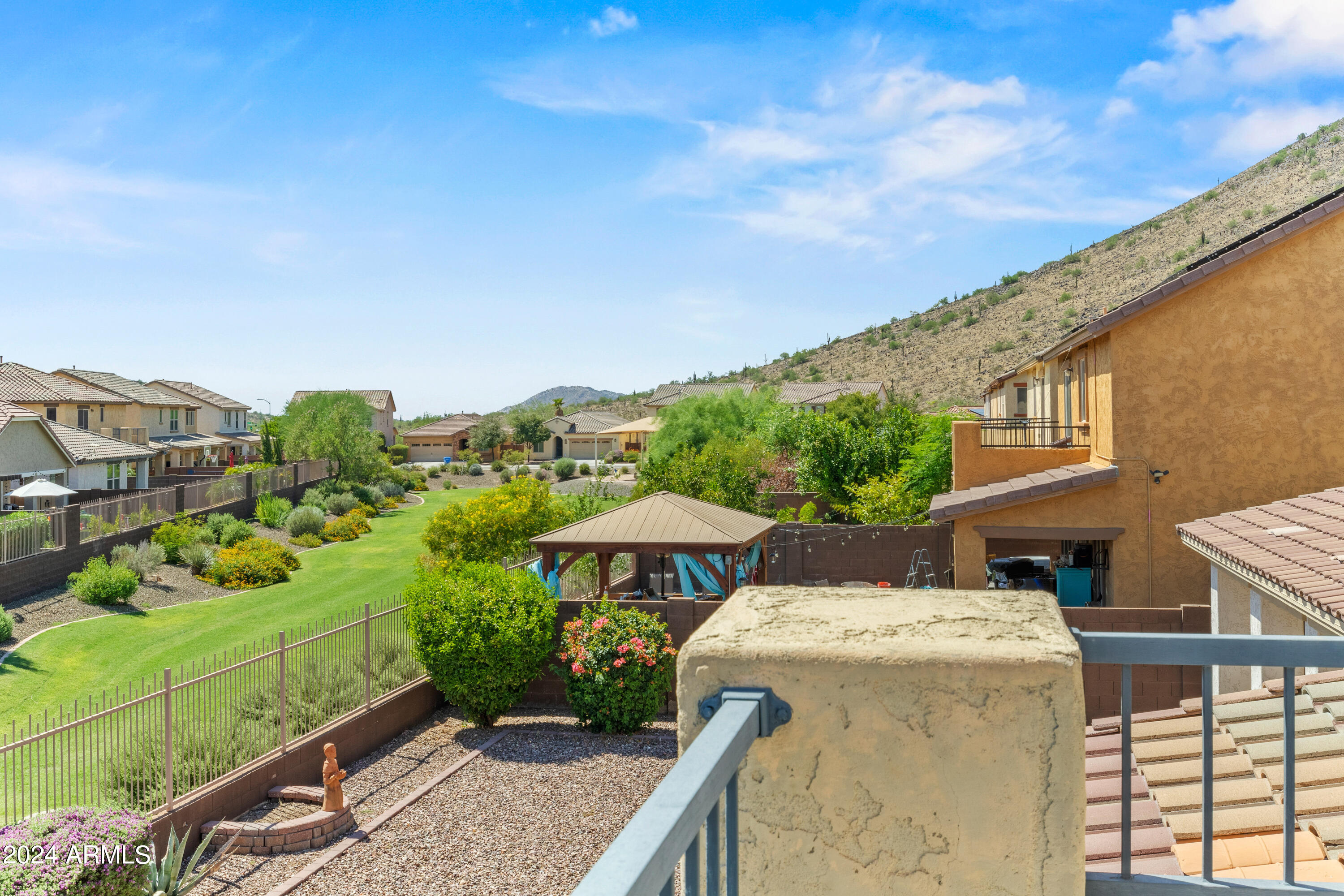 5515 West Hackamore Drive Phoenix, AZ 85083 - Photo 17 of 35 a view of a patio with table and chairs under an umbrella