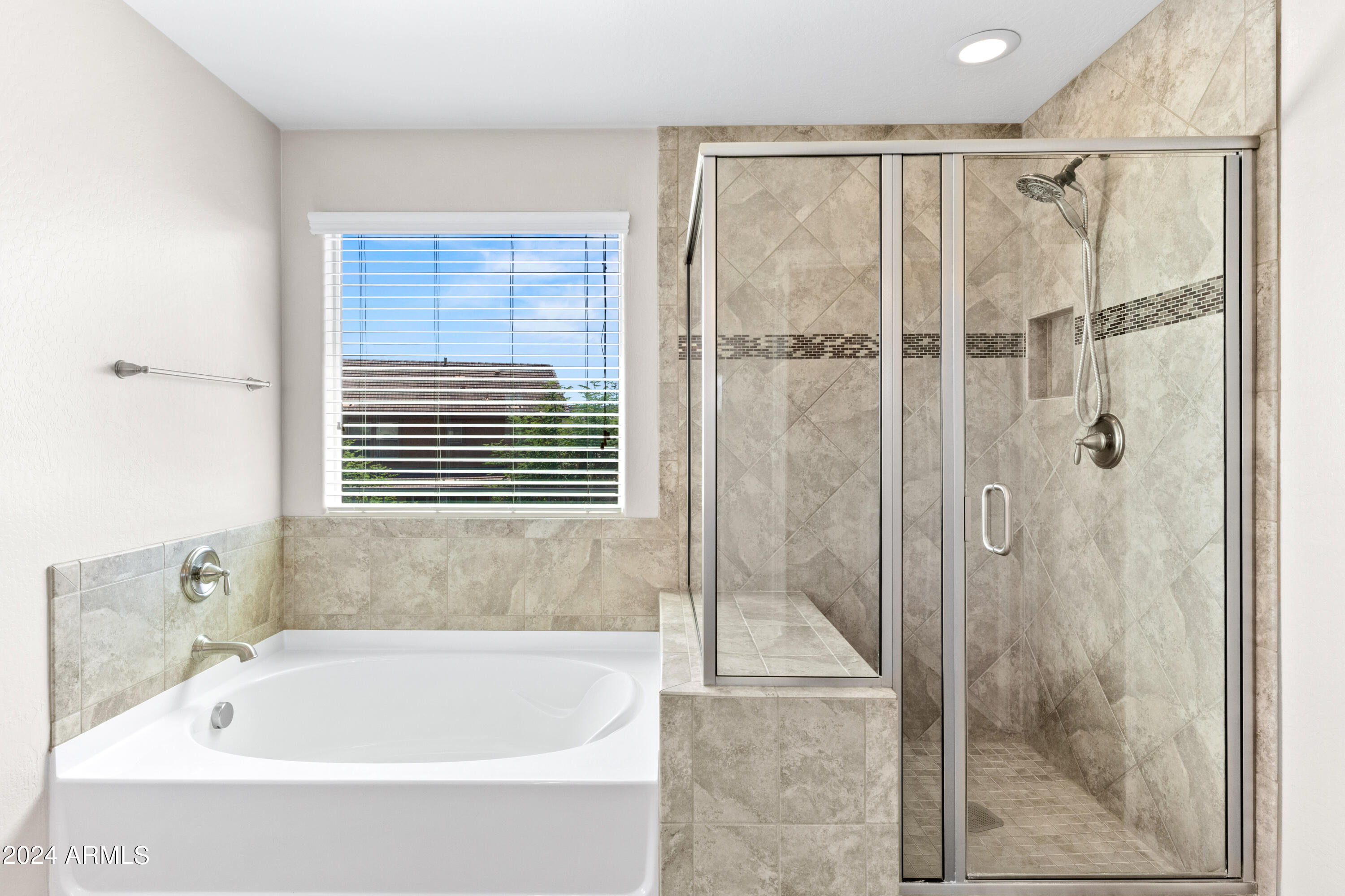 5515 West Hackamore Drive Phoenix, AZ 85083 - Photo 18 of 35 a bathroom with a bathtub and shower