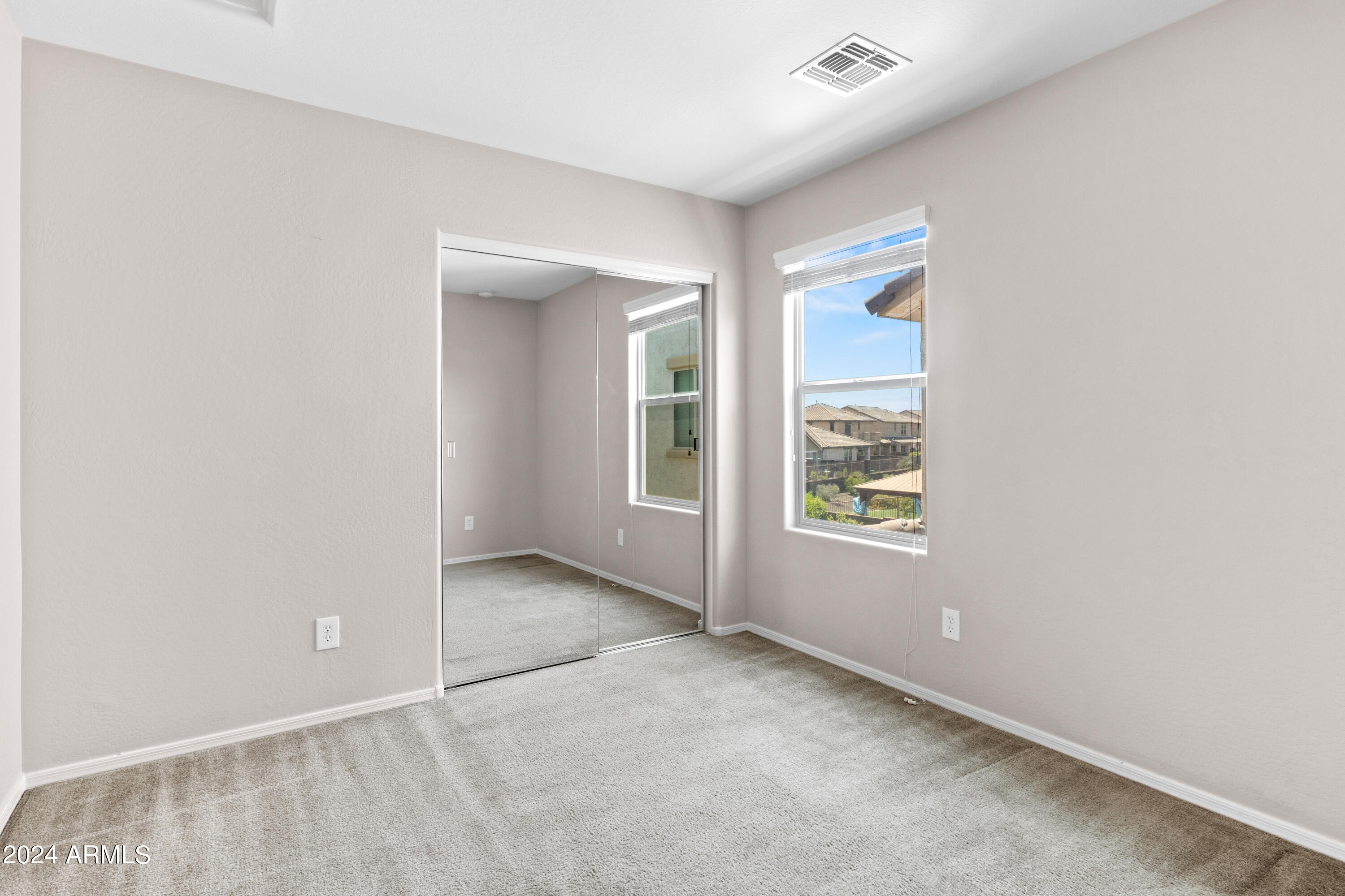 5515 West Hackamore Drive Phoenix, AZ 85083 - Photo 22 of 35 an empty room with windows