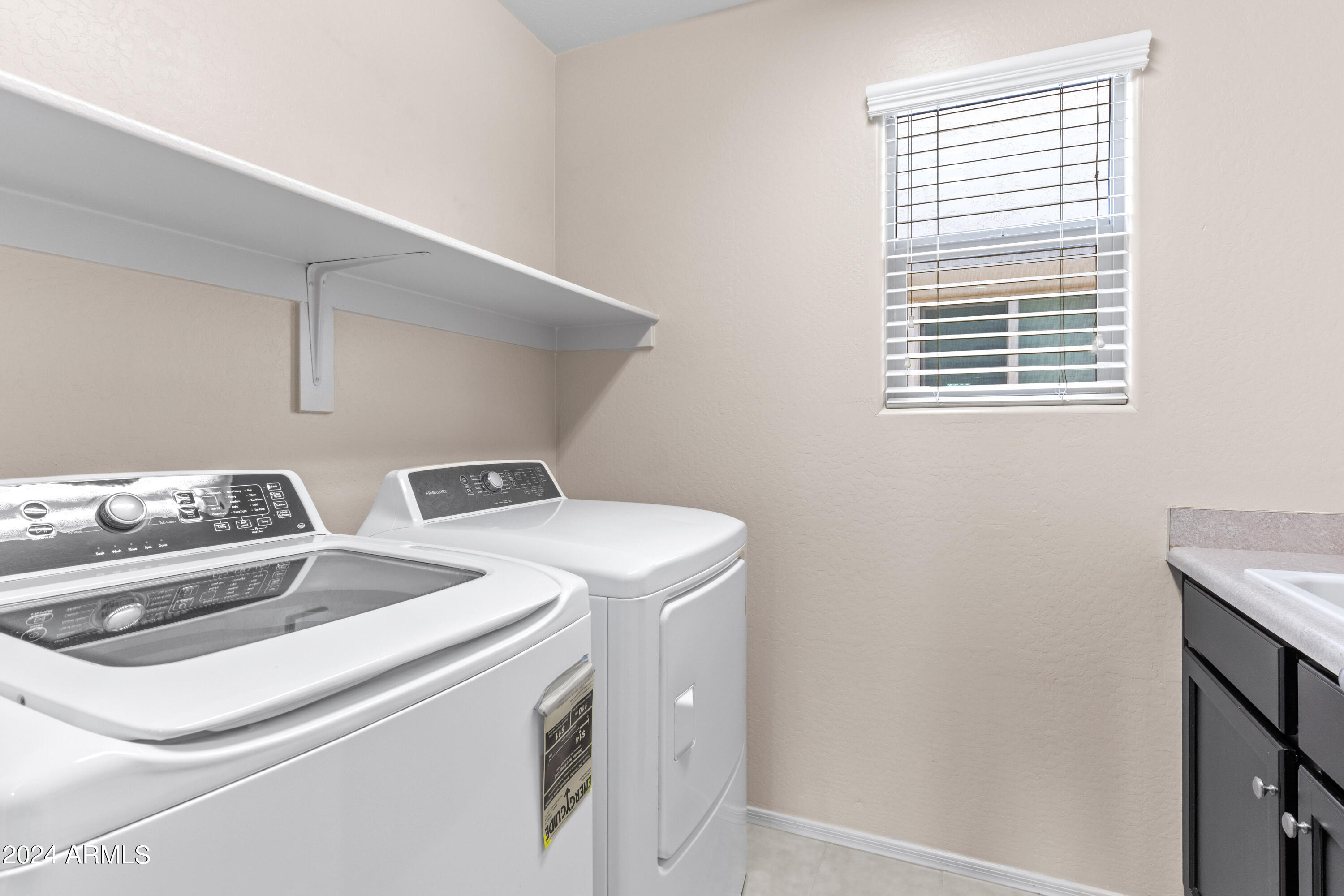 5515 West Hackamore Drive Phoenix, AZ 85083 - Photo 26 of 35 a utility room with dryer and washer