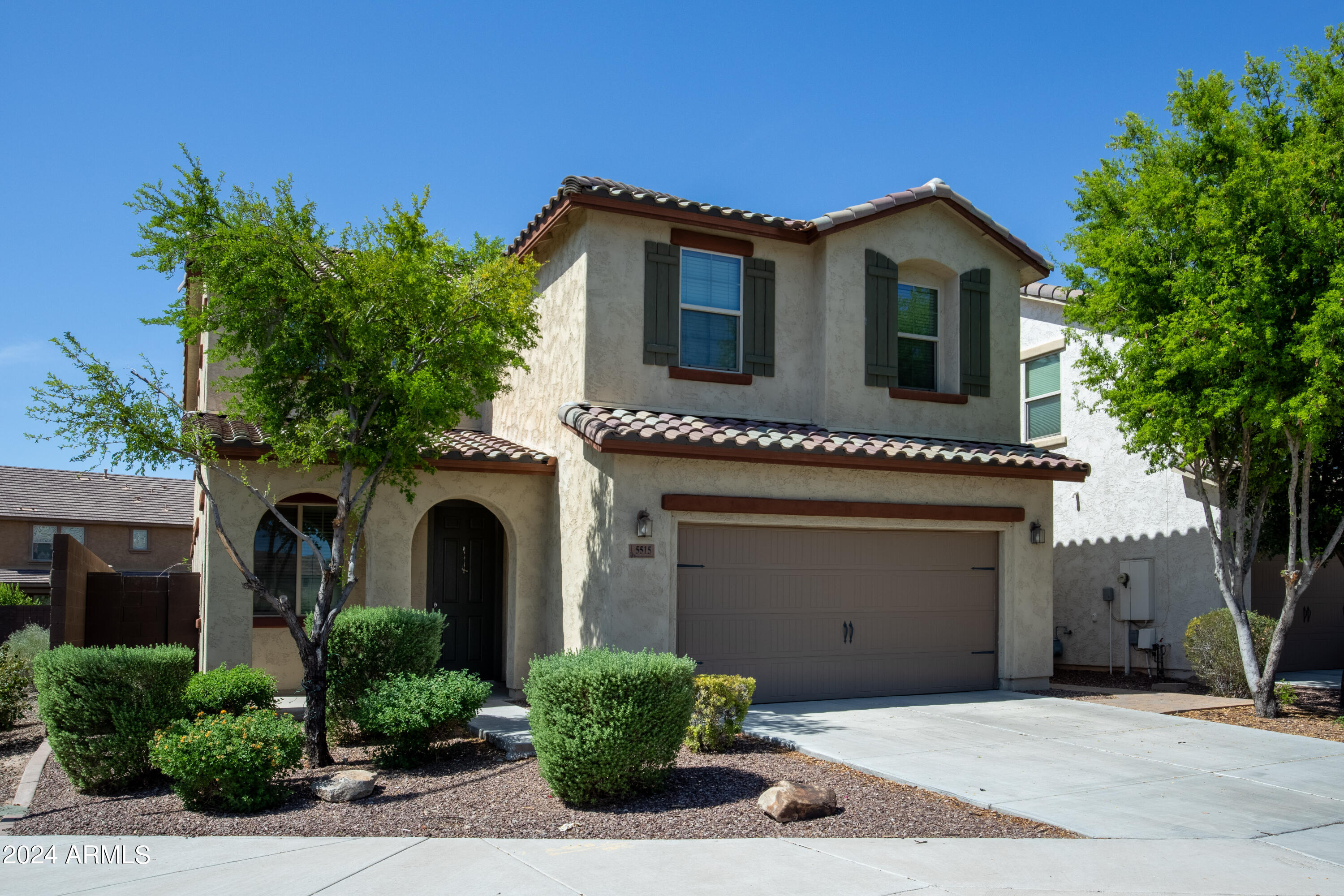 5515 West Hackamore Drive Phoenix, AZ 85083 - Photo 35 of 35 a front view of a house with a garden and plants