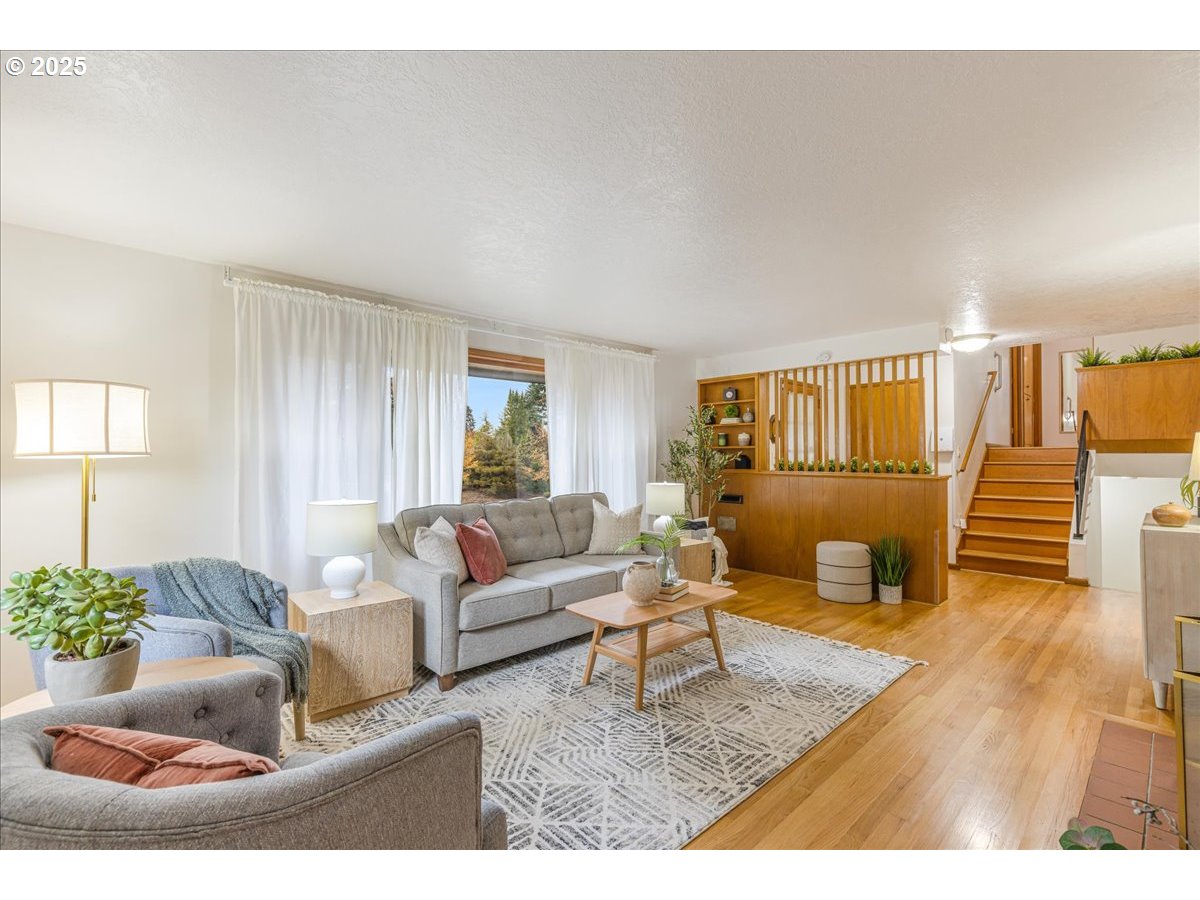 11030 Northeast Davis Street Portland, OR 97220 - Photo 14 of 48 a living room with furniture and a wooden floor