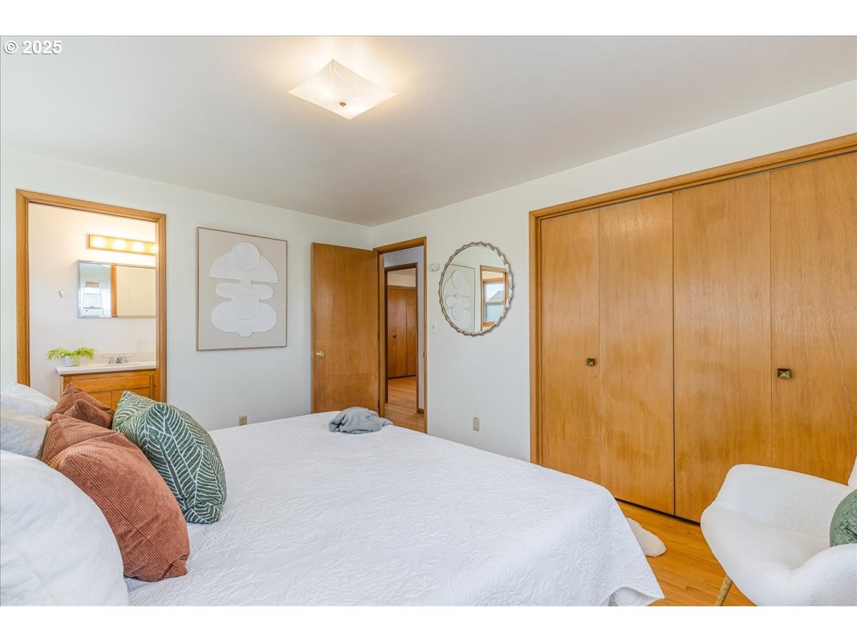 11030 Northeast Davis Street Portland, OR 97220 - Photo 25 of 48 a bedroom with a bed and window