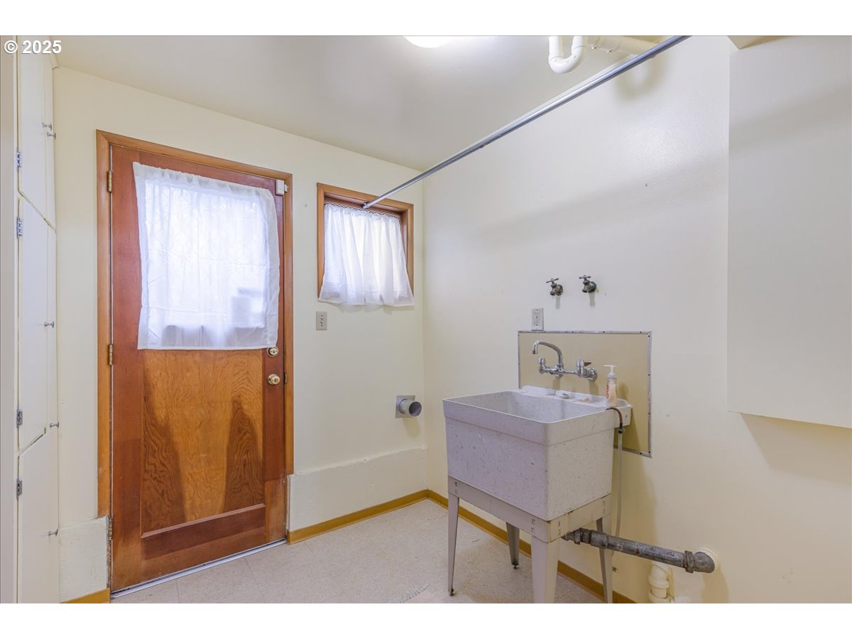 11030 Northeast Davis Street Portland, OR 97220 - Photo 31 of 48 a bathroom with a sink and a mirror