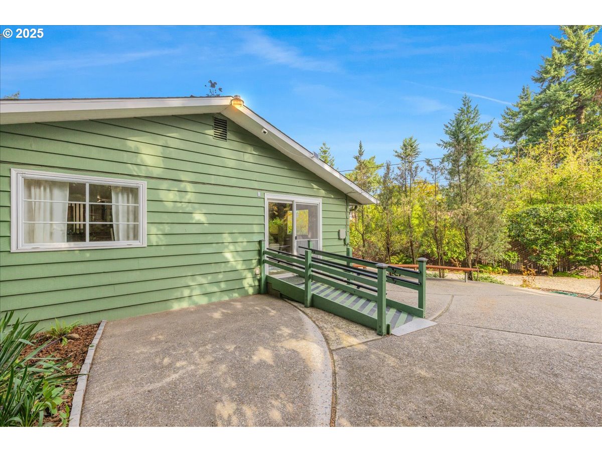 11030 Northeast Davis Street Portland, OR 97220 - Photo 39 of 48 a view of a backyard with a garden and staircase