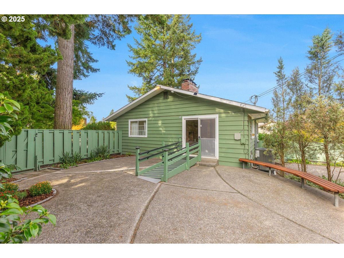 11030 Northeast Davis Street Portland, OR 97220 - Photo 43 of 48 a view of house with backyard and outdoor seating