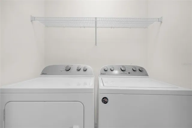 a utility room with dryer and washer