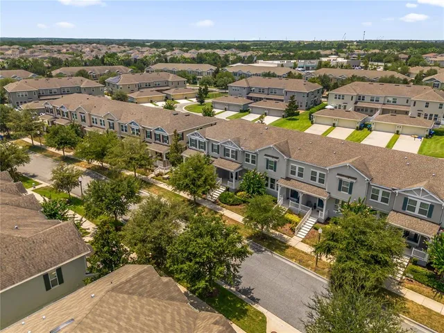 an aerial view of a house with big yard
