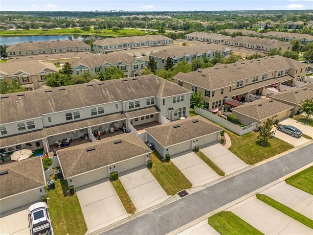 an aerial view of residential houses with outdoor space