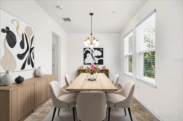 a dining room with furniture and window