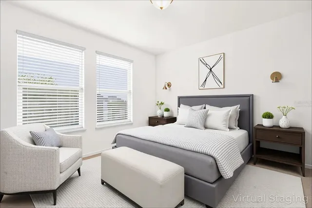 a bedroom with bed and window