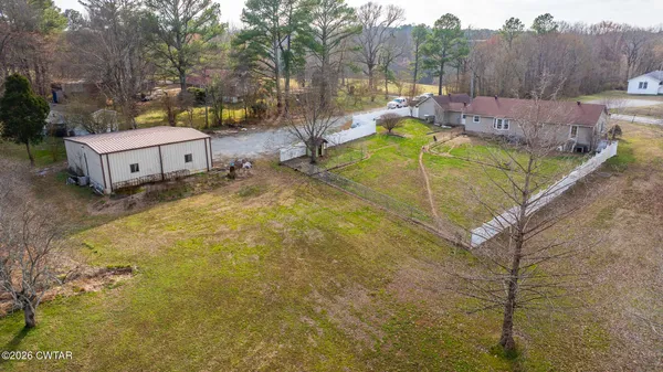 a view of a swimming pool with a yard