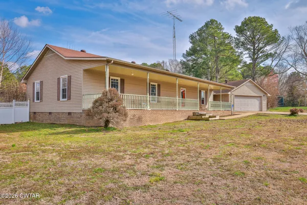 a view of yard with large trees