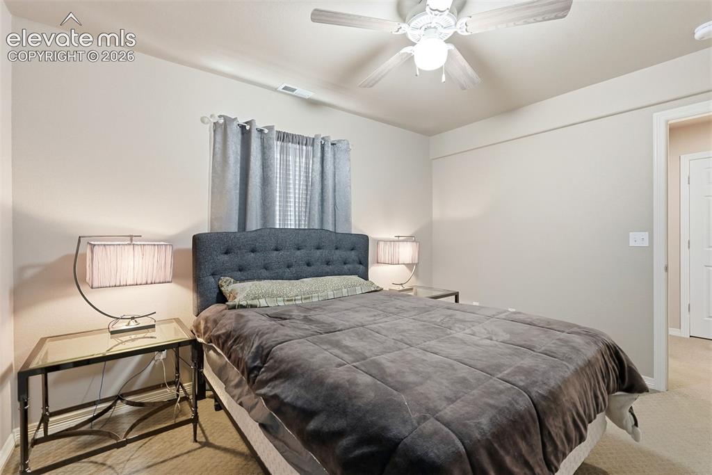 2264 Reed Grass Way Colorado Springs, CO 80915 - Photo 41 of 50 a bedroom with a bed and window